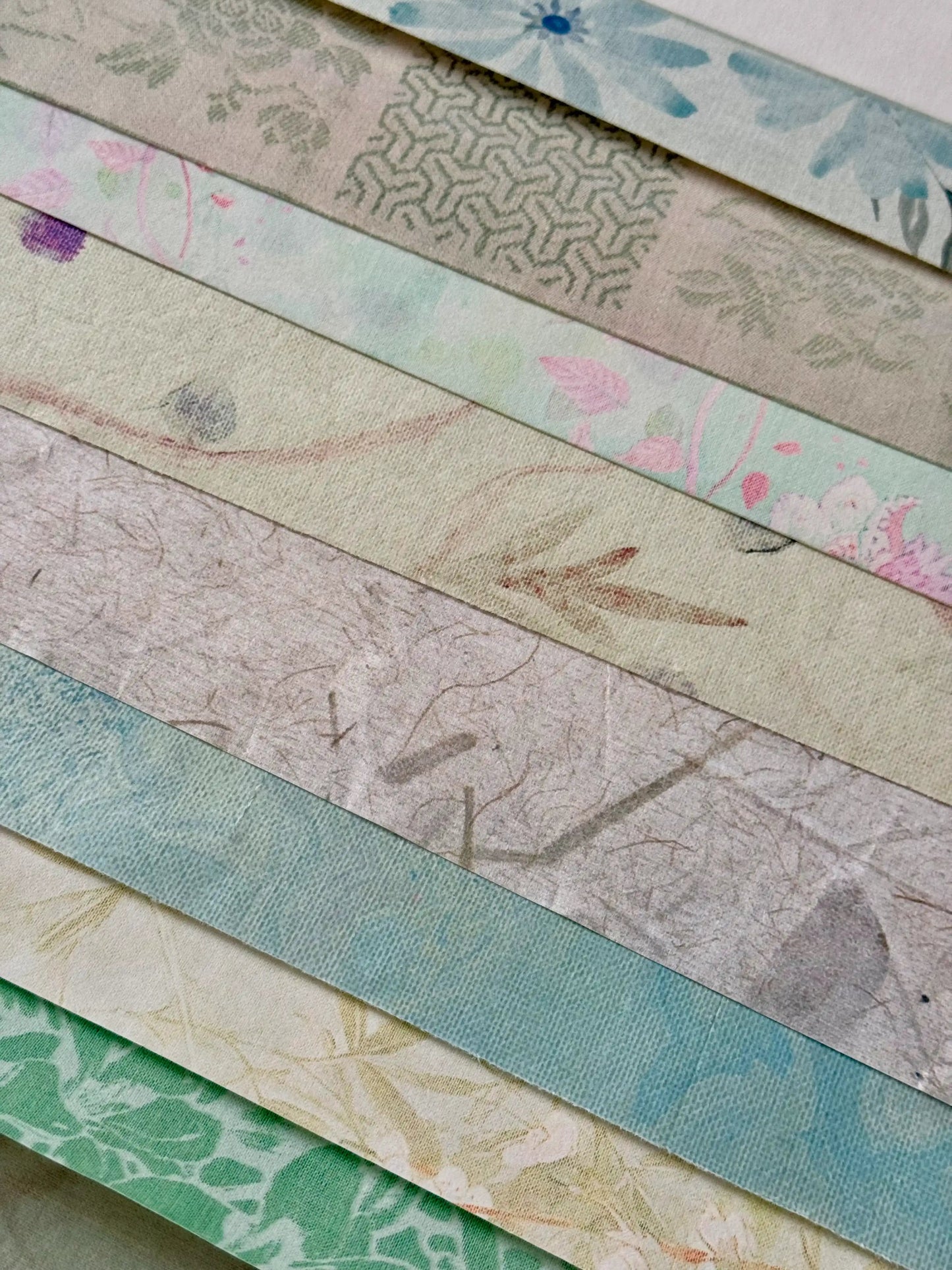 Collection of variously patterned xuan paper for chinese calligraphy in pastel colors.