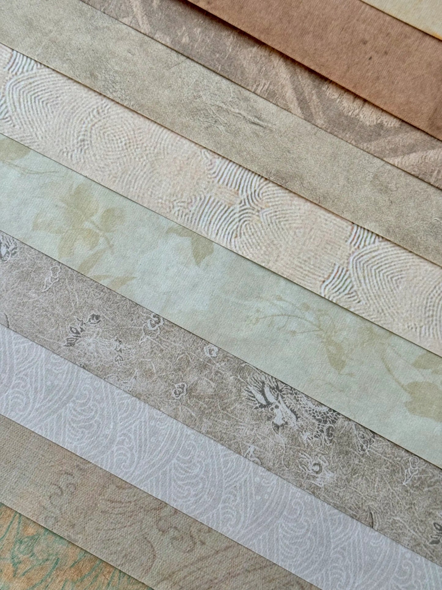 Collection of textured designed xuan paper in various beige brown colours